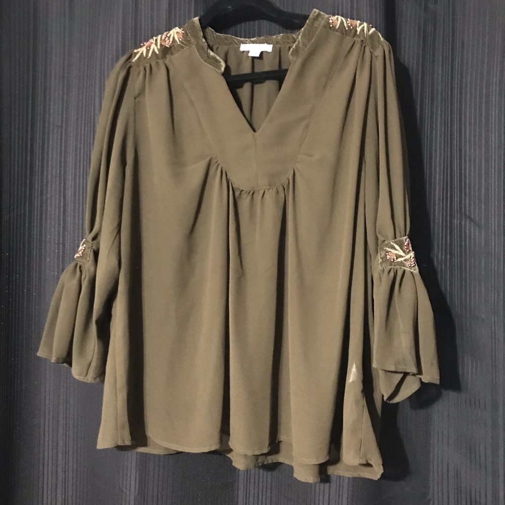 Sheer Forrest green top with beading.